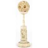 Chinese Canton carved ivory puzzle ball on stand, 16.5cm high