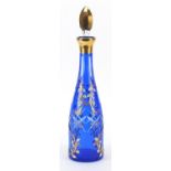 Attributed to Moser, Bohemian blue overlaid glass decanter enamelled with flowers, 40cm high