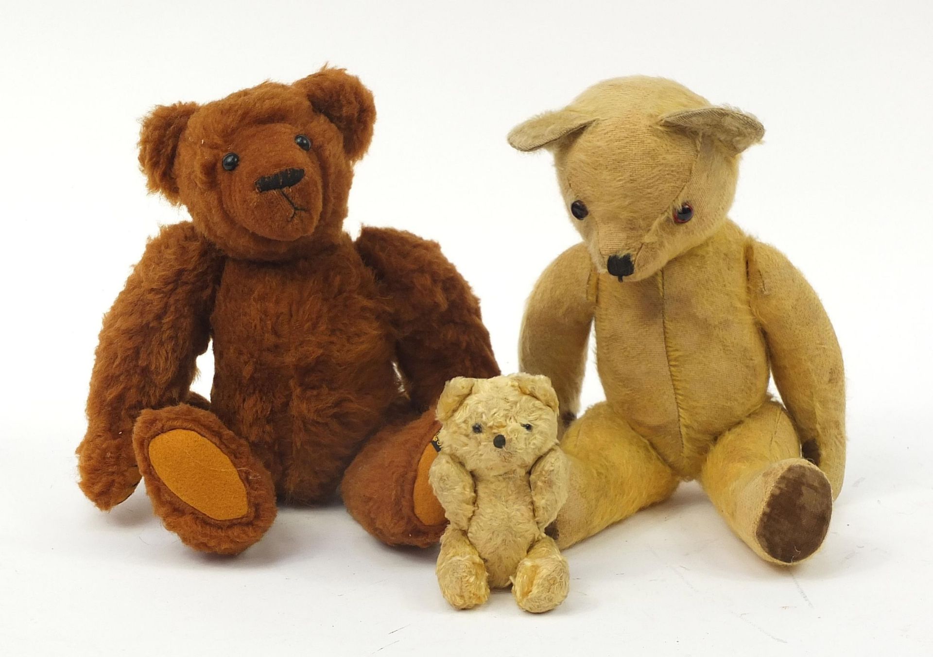 Three antique and later teddy bears with jointed limbs including one by Sharon Donovan with growler,