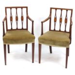 Pair of Edwardian inlaid mahogany open armchairs raised on square tapering legs, 86.5cm high