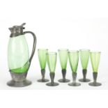 Archibald Knox for Liberty & Co, Arts & Crafts pewter and green glass liqueur set comprising jug and