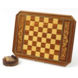 Italian Sorrento design chess board and a miniature carved wood chess set, the board 52cm x 39cm