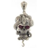 Silver human skull and serpent pendant with ruby eyes, 4.5cm high, 13.7g