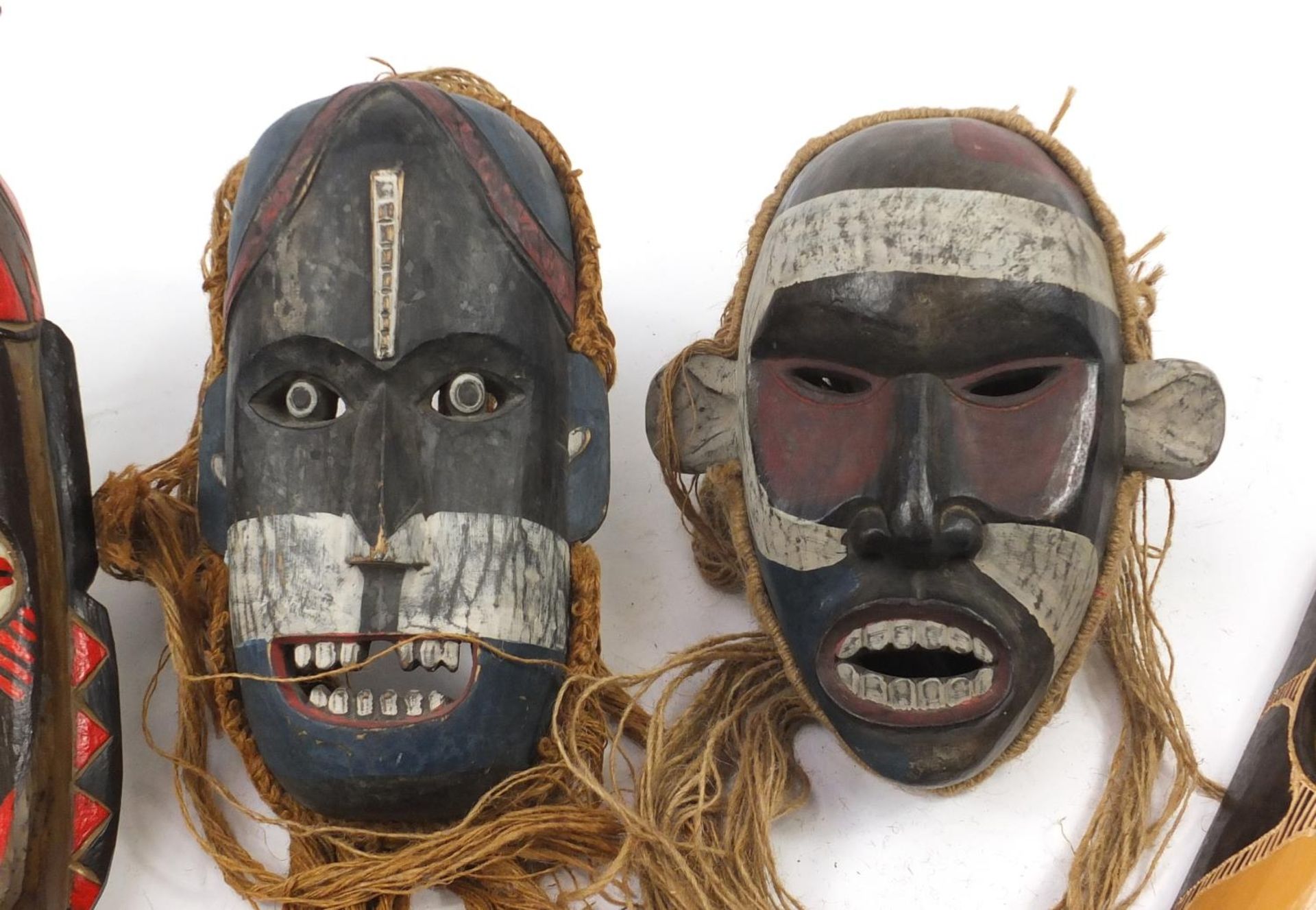 Six hand painted African carved wood face masks, the largest 46cm high - Image 3 of 7