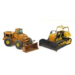 Two large vintage tinplate agricultural toy vehicles including a Mighty Tonka Dozer T-9, the largest
