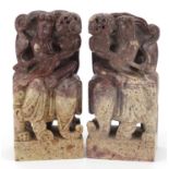 Pair of Chinese carved soapstone bookends in the form of a female on an elephant, each 19cm high