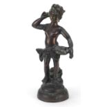 Patinated bronze semi nude figure carrying a basket of fish, 41cm high