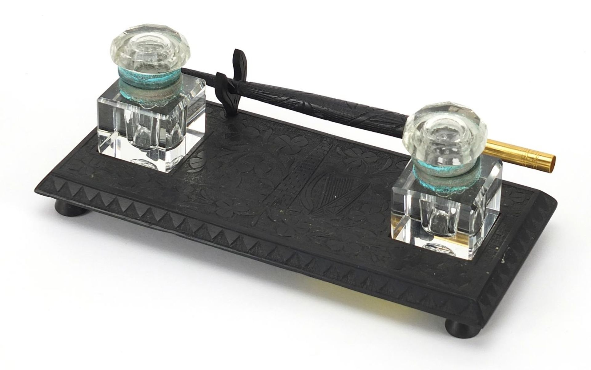 Irish bog oak desk stand with dip pen and cut glass inkwells, 17.5cm wide