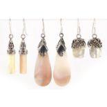 Three pairs of silver mounted shell earrings, the largest 4.5cm high, total 22.6g
