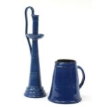 C H Brannam pottery blue glazed jug and a similar candlestick, the largest 44cm high