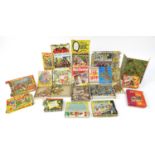 Collection of vintage jigsaw puzzles including Batman, Popeye, Yogi Bear, Disneyland and Sooty