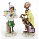 Pair of Continental porcelain monkey band musicians, the largest 12.5cm high