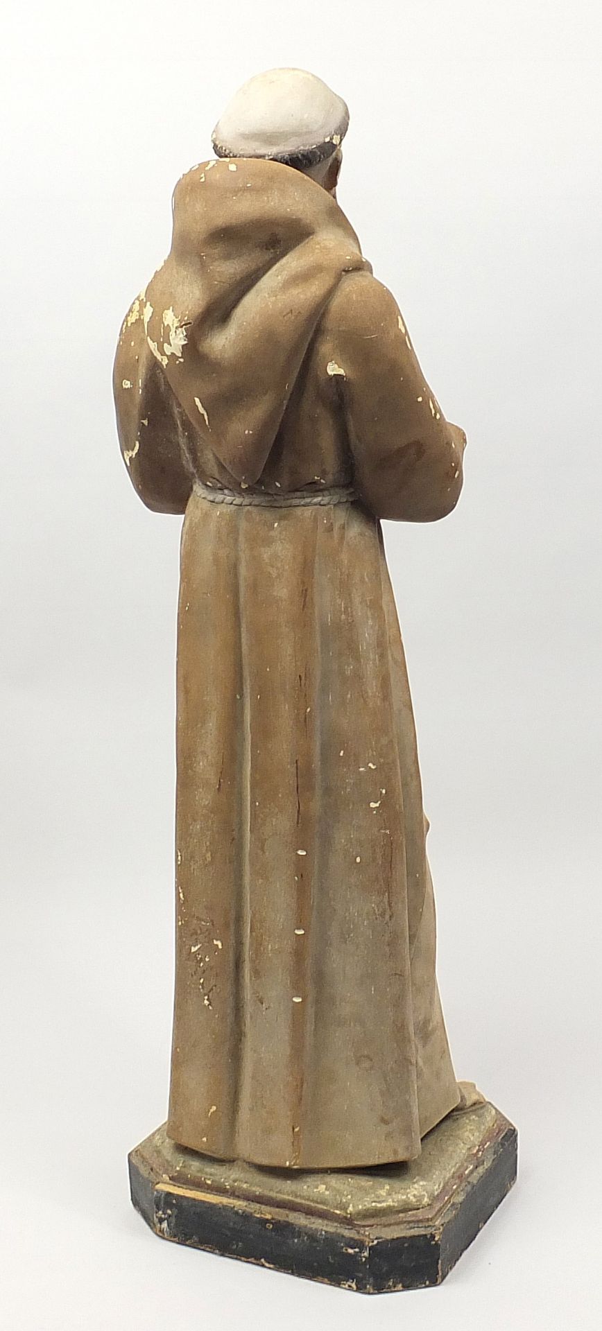 Large floor standing plaster figure of St Francois d'Assise raised on a painted wooden base, 137cm - Image 3 of 3