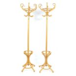 Pair of light bentwood hat and coat stands, 194cm high