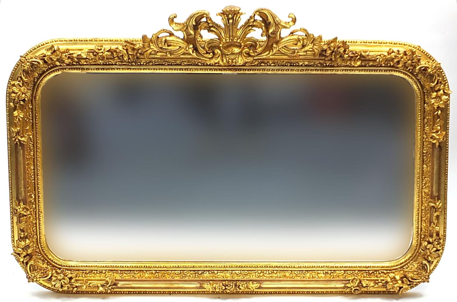 Large ornate gilt framed wall hanging mirror with bevelled glass, 140cm x 97cm