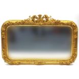 Large ornate gilt framed wall hanging mirror with bevelled glass, 140cm x 97cm