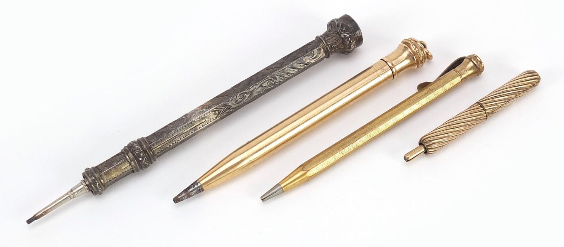 Propelling pencils including a large silver example with citrine top end, the largest 10.5cm in