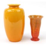 Two Pilkington Royal Lancastrian orange glazed vases numbered 2671 and 2778, the largest 27cm high