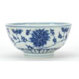 Chinese blue and white porcelain bowl hand painted with flower heads amongst scrolling foliage,