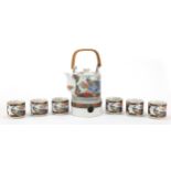 Japanese porcelain teaware decorated in the Imari palette including a teapot and stand, the
