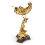 Classical gilt bronze centrepiece in the form of a mermaid holding a shell, 38cm high