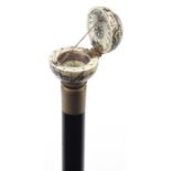 Hardwood walking stick with carved bone globe pommel opening to reveal a compass, 84cm in length