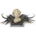 Silvered metal and Putti design wall plaque, 52.5cm wide