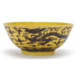 Chinese yellow porcelain bowl hand painted with dragons on the exterior, blue six figure character