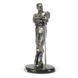 Silvered model of a golfer by Compulsion Gallery, raised on an oval marble base, 47cm high