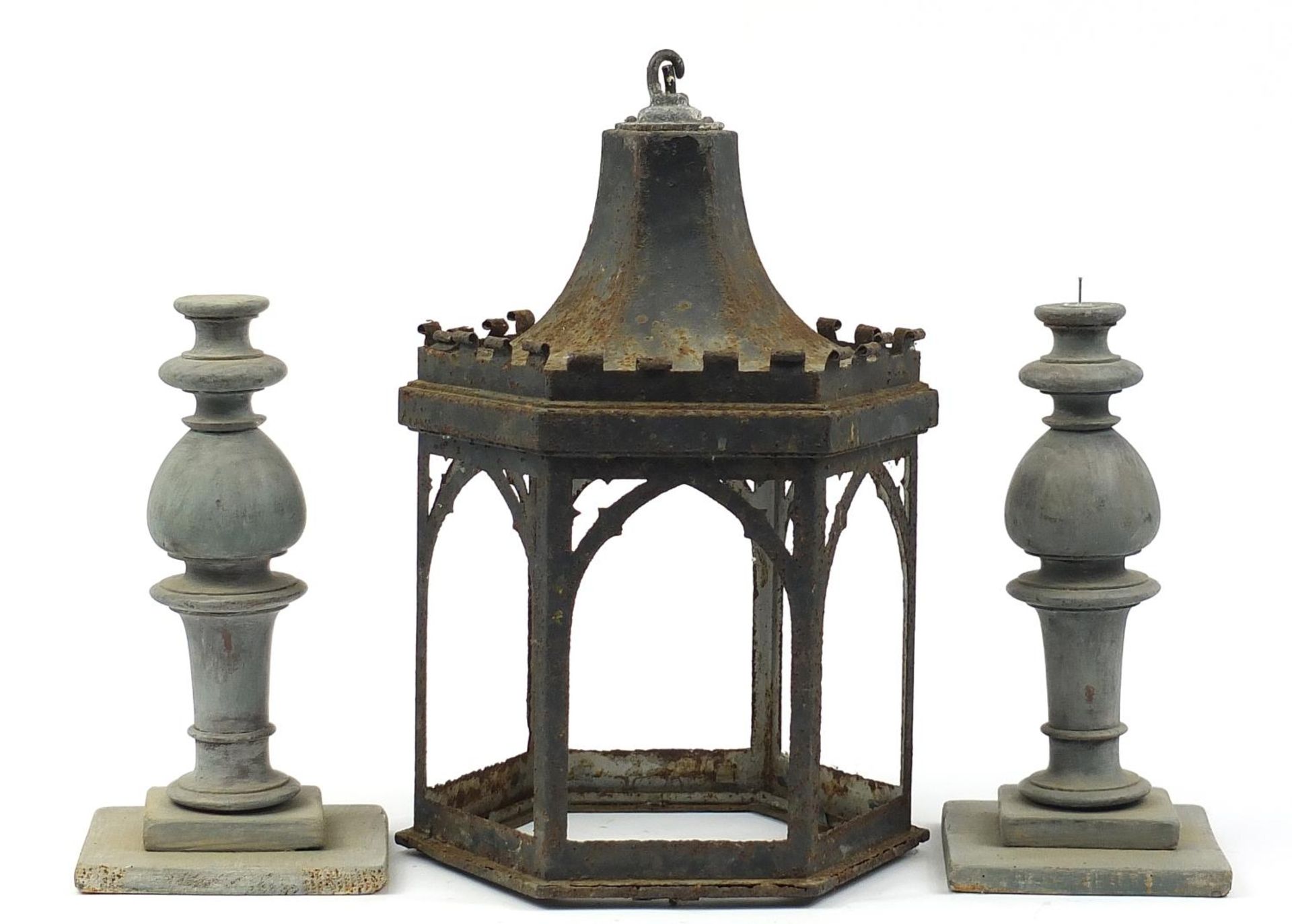 Vintage wrought iron lantern and a pair of turned wood candle stands, the lantern 49cm high