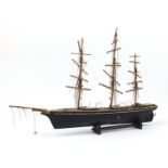 Hand painted wooden model of a rigged sailing ship, 73cm in length