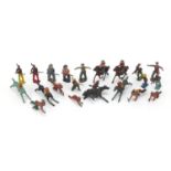Vintage hand painted lead figures including cowboys, Indians and jockeys on horseback, the largest