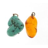 Two pendants comprising turquoise matrix and amber, 2.5cm and 3cm high, total 18.0g