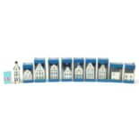 Ten KLM Bols house design decanters, nine with contents and boxes, the largest 12cm high