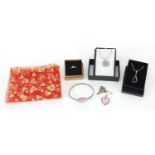 Silver jewellery comprising amber pendant on chain, mother of pearl love heart bangle and