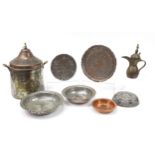 Middle Eastern metalware including an Omani coffee pot and dish engraved with script, the largest 4