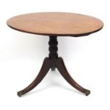 Victorian walnut and mahogany tilt top table with tripod base and brass casters, 73cm H x 95cm W x