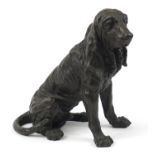 Patinated bronze seated Bloodhound, 36cm high