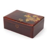 Japanese lacquered box gilded with two birds amongst flowers, 9cm H x 22.5cm W x 15cm D