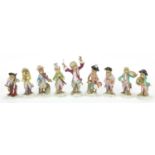Set of nine German porcelain monkey band musicians, each with various numbers to the base, the