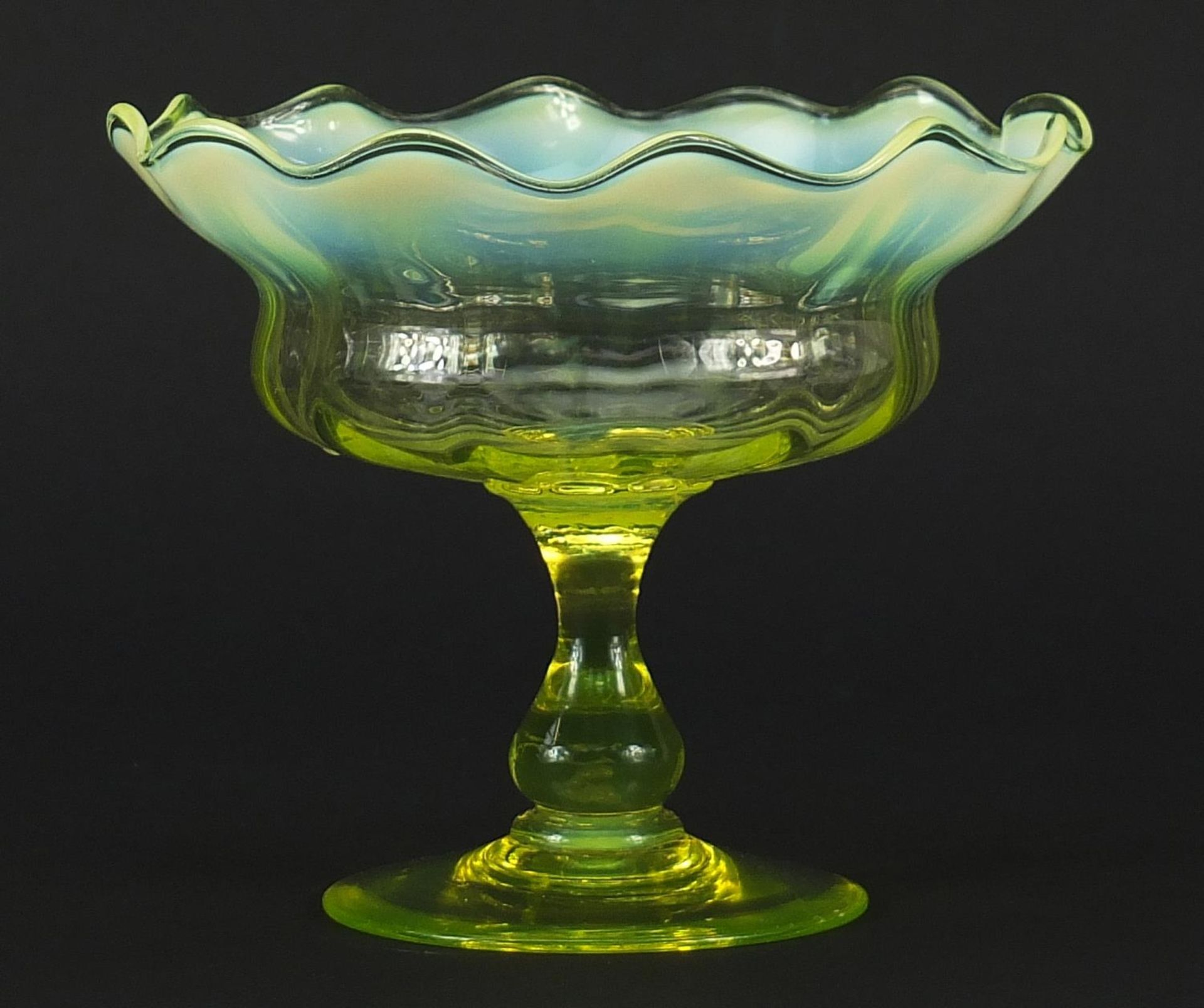 Art Nouveau Vaseline glass pedestal bowl with frilled rim, 12.5cm high x 15cm in diameter