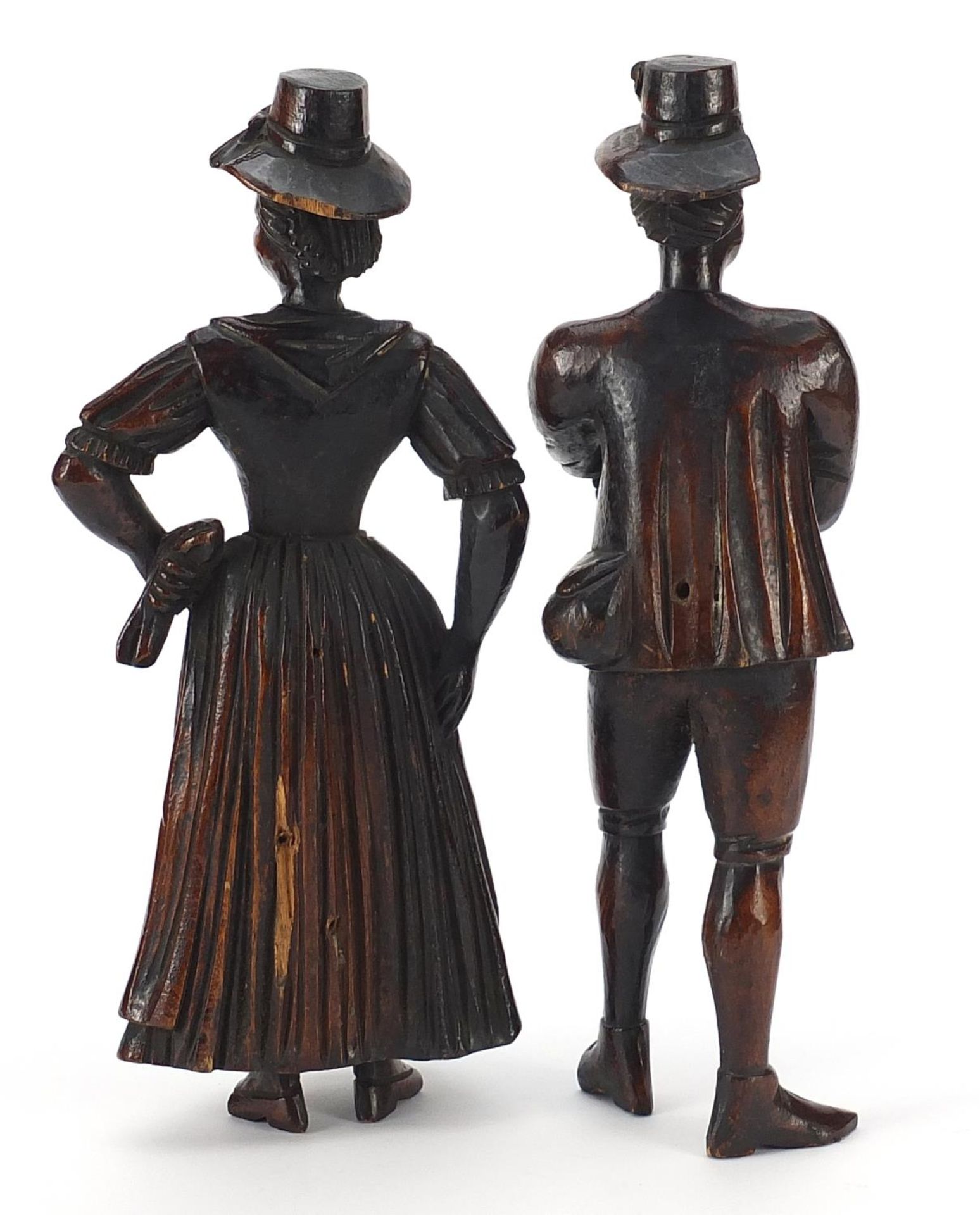 Pair of antique continental wood carvings of peasants in 18th century dress, the largest 22cm high - Image 2 of 3