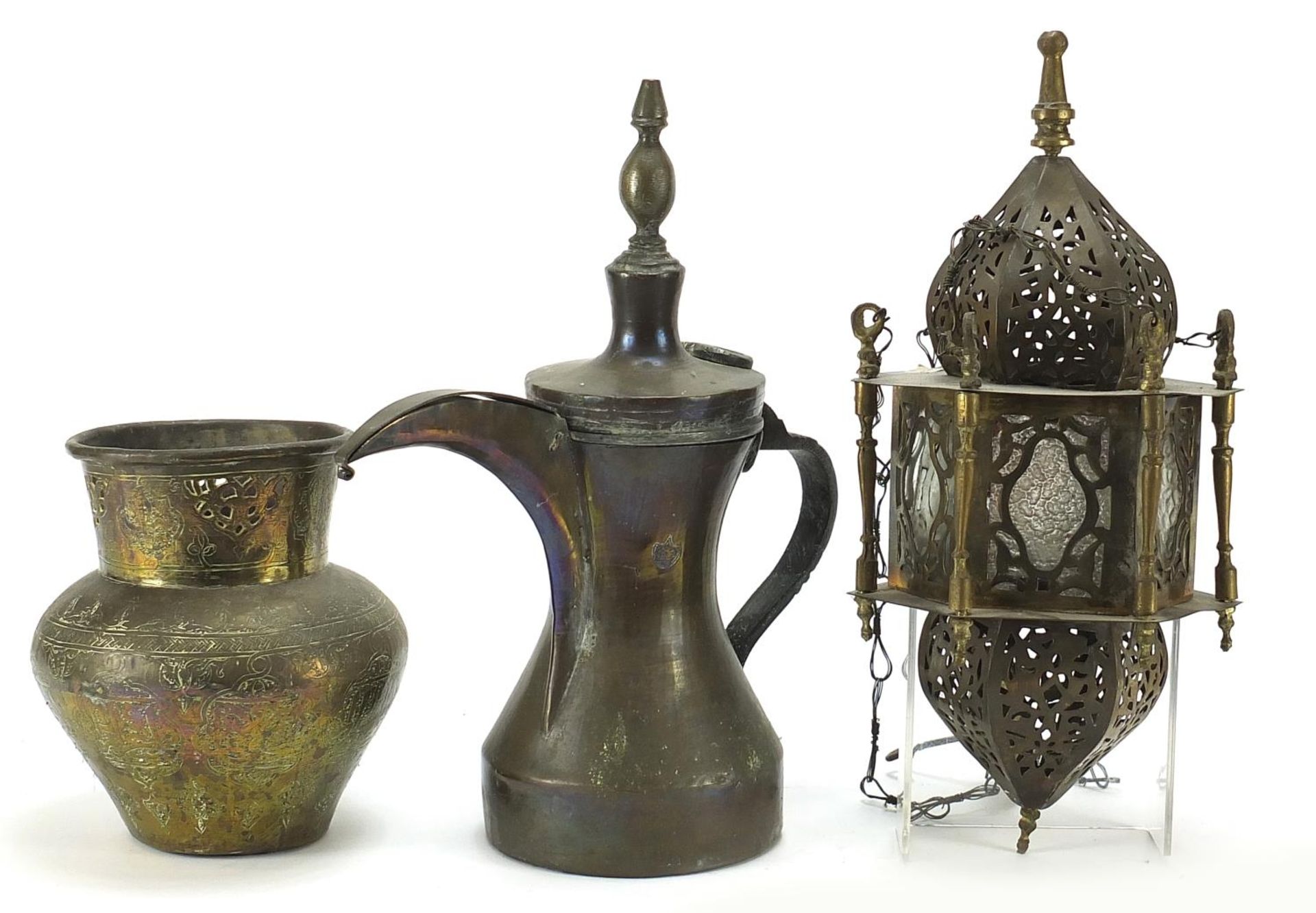 Middle Eastern metalware including an Omani coffee pot and Moroccan hanging lamp, the largest 30.5c