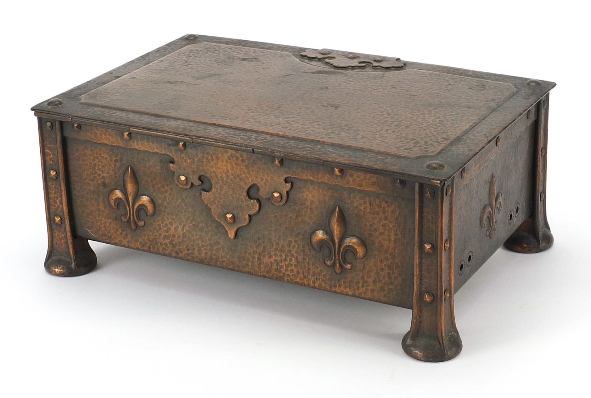James Smithies of Wilmslow, Arts & Crafts copper casket with fleur de Lys, 10.5cm H x 26cm W x
