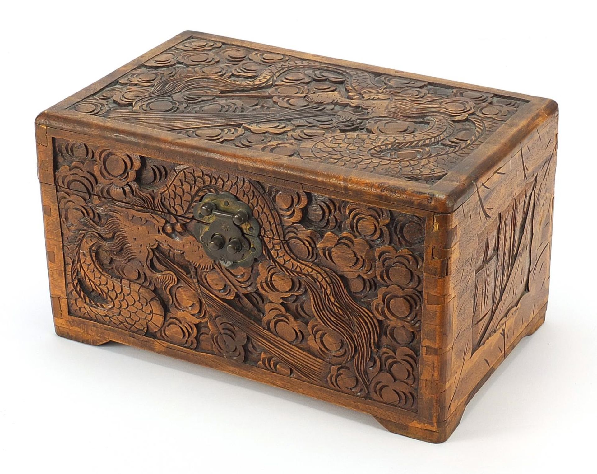 Chinese camphor wood table top chest carved with dragons amongst clouds, 17cm H x 30cm W x 19cm D