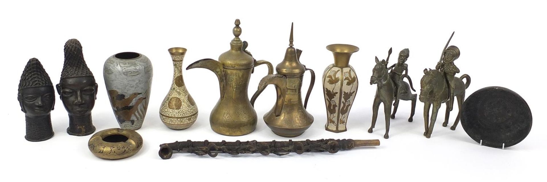 African and Persian metalware including a pair of Imani Dallah coffee pots, pair of Benin style