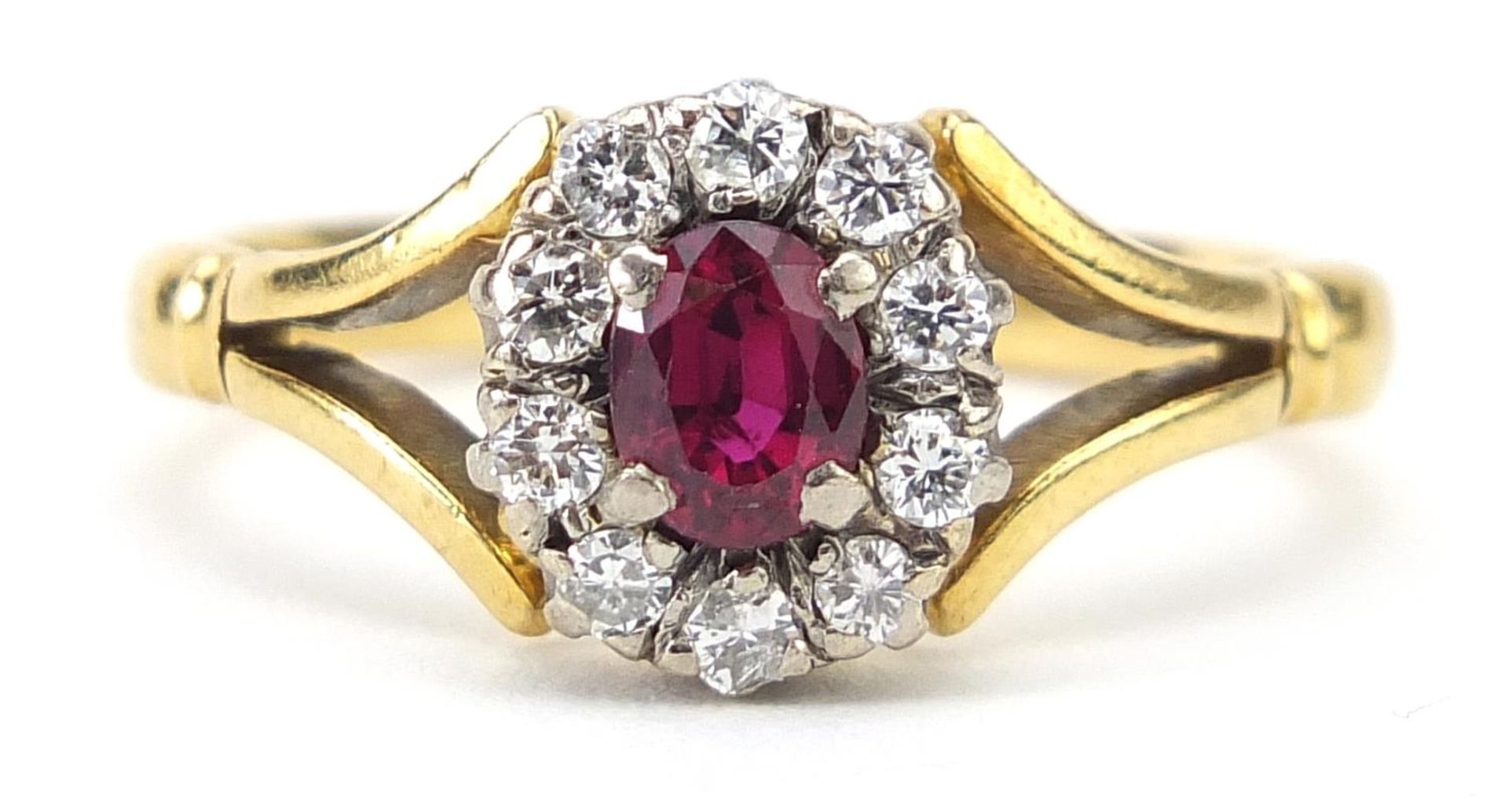 Unmarked gold ruby and diamond cluster ring housed in a Bruford Eastbourne-Exeter box, size R/S, 5.