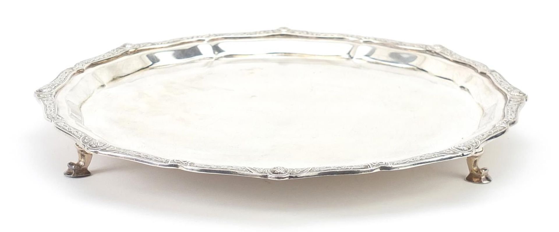 Garrard & Co Ltd, circular silver salver with Celtic design border and raised on three feet, - Image 5 of 5