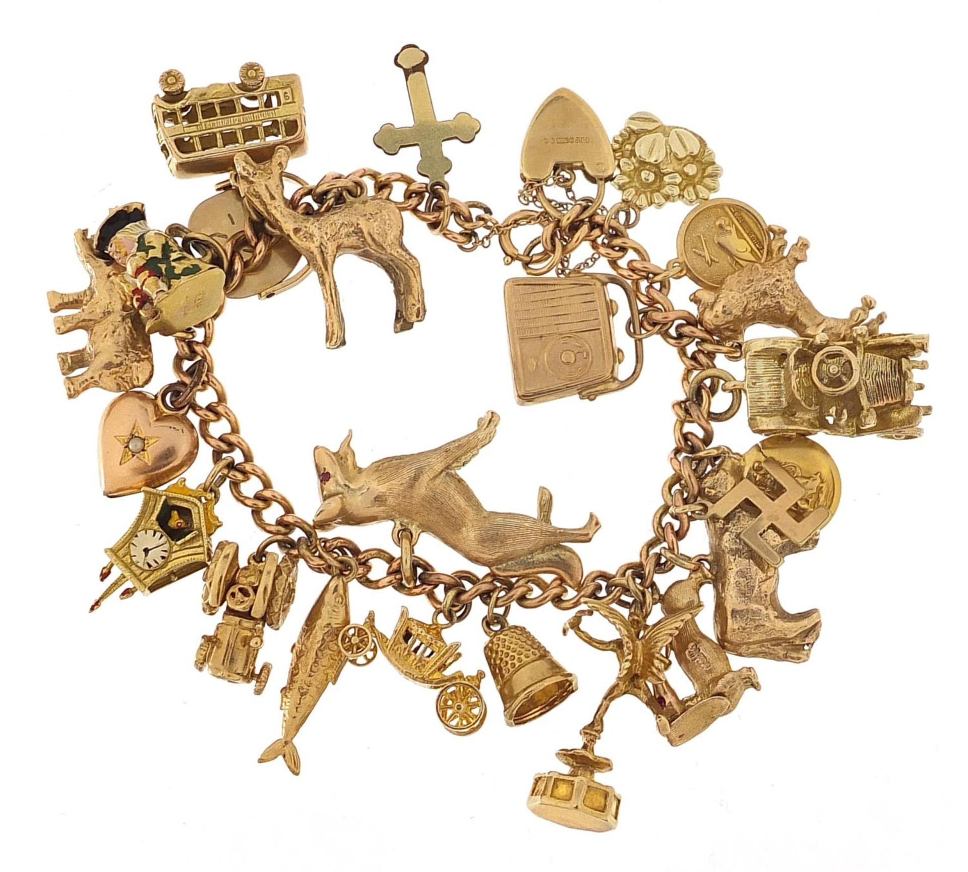 9ct gold charm bracelet with a large selection of mostly 9ct gold charms including Alsatian dog,