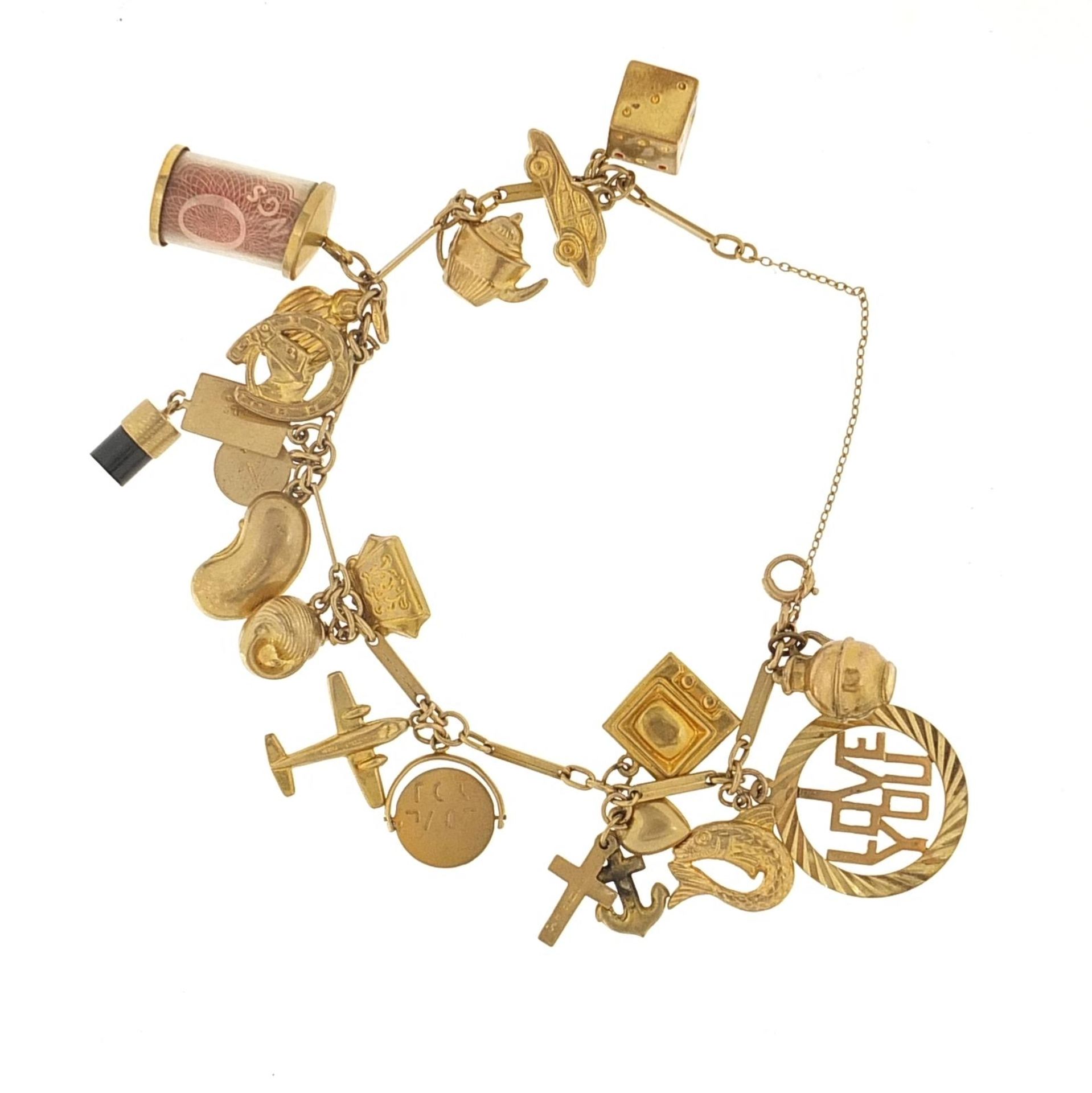 9ct gold charm bracelet with a selection of mostly 9ct gold charms including emergency ten - Bild 2 aus 3